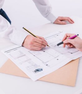 0_0002_crop-hands-correcting-blueprint